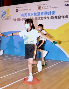 Photo shows ten students from the Yaumati Catholic Primary School (Hoi Wang Road) demonstrating an online physical activity class with coach using Zoom.