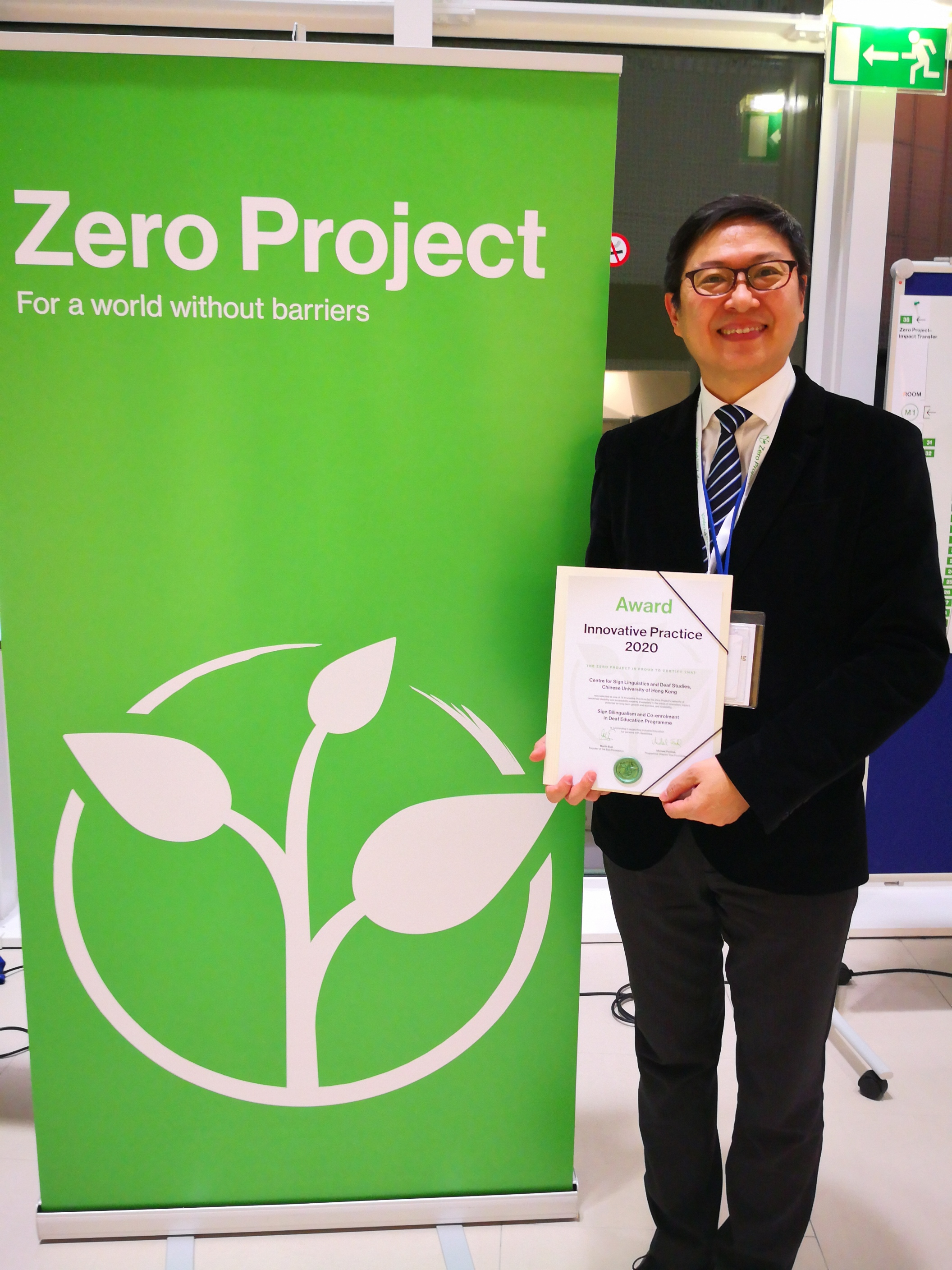 Chris Yiu from CUHK CSLDS receives the Zero Project 2020 Innovative Practice Award on Education on behalf of the SLCO team.