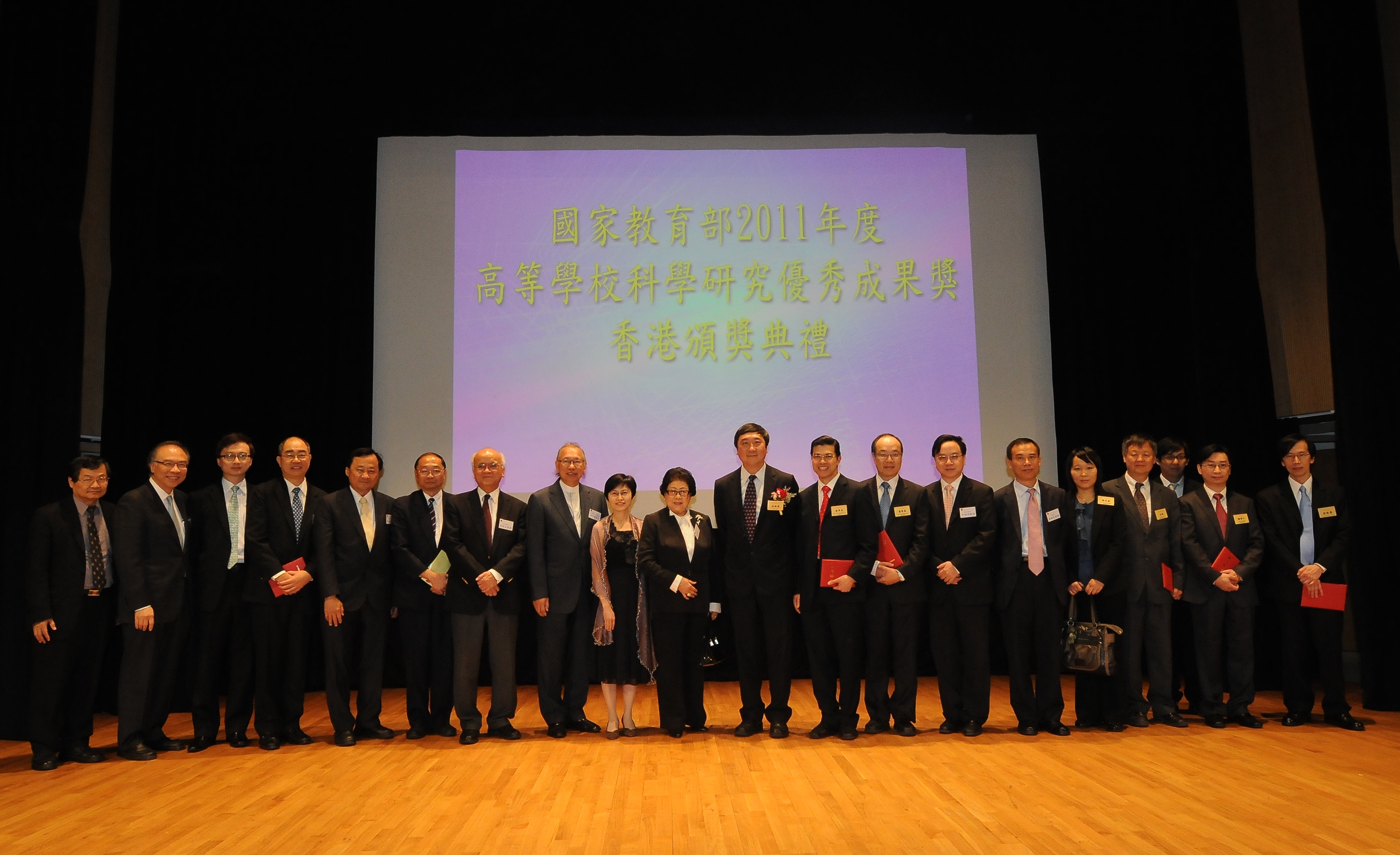 A group photo of CUHK award recipients with their guests and colleagues.