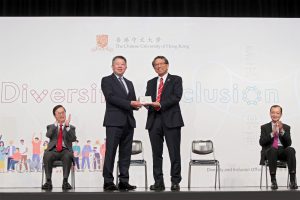 Professor Rocky Tuan, Vice-Chancellor and President of CUHK (right, front row) presents a souvenir to Mr. Ricky Chu, Chairperson of EOC.