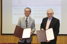 Prof. Tai Fai FOK (left) and Prof. Arthur BEAUDET sign and present the memorandum of understanding.