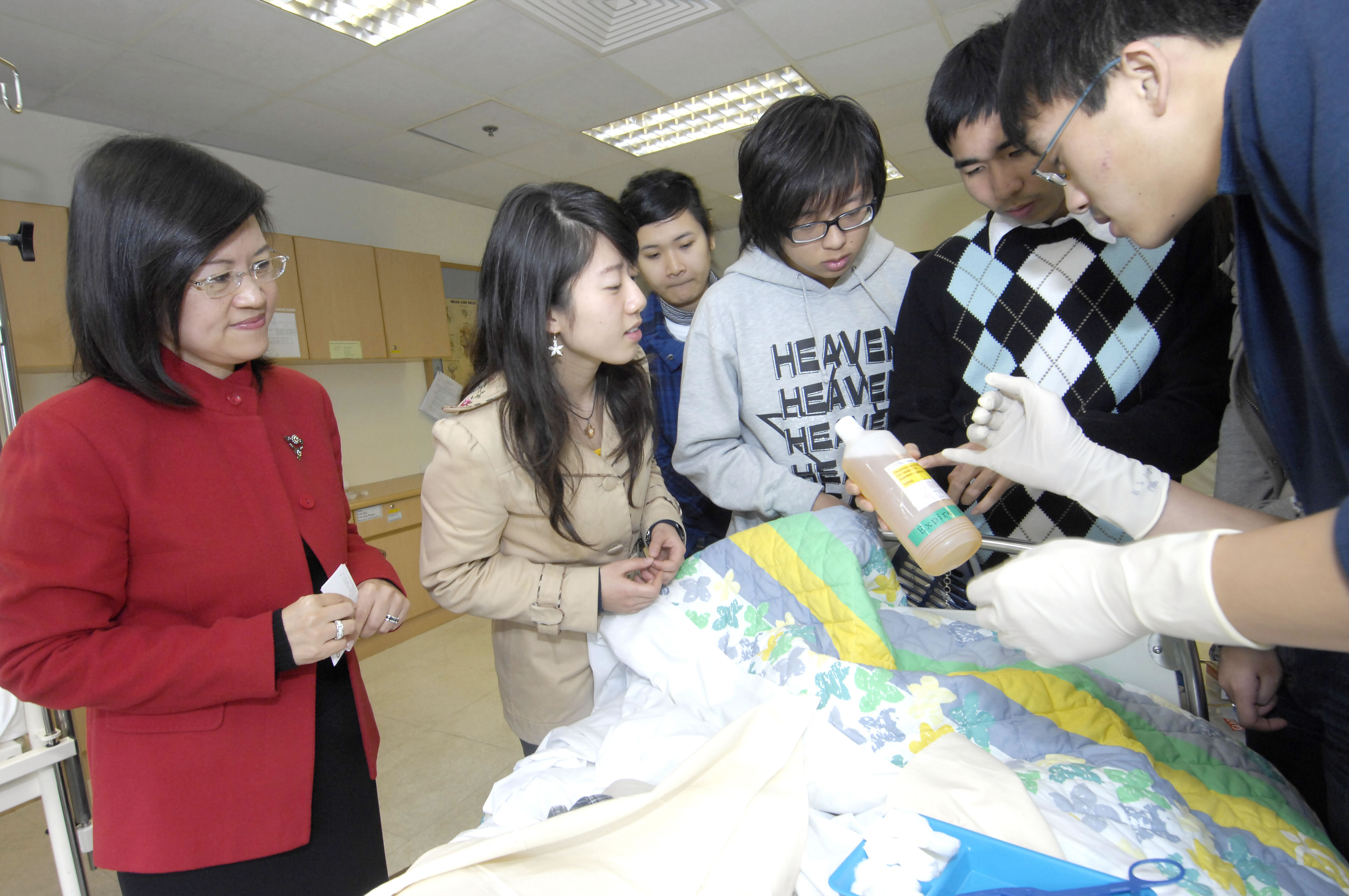 Prof. Diana Lee supervising students of the Nethersole School of Nursing at the laboratory.