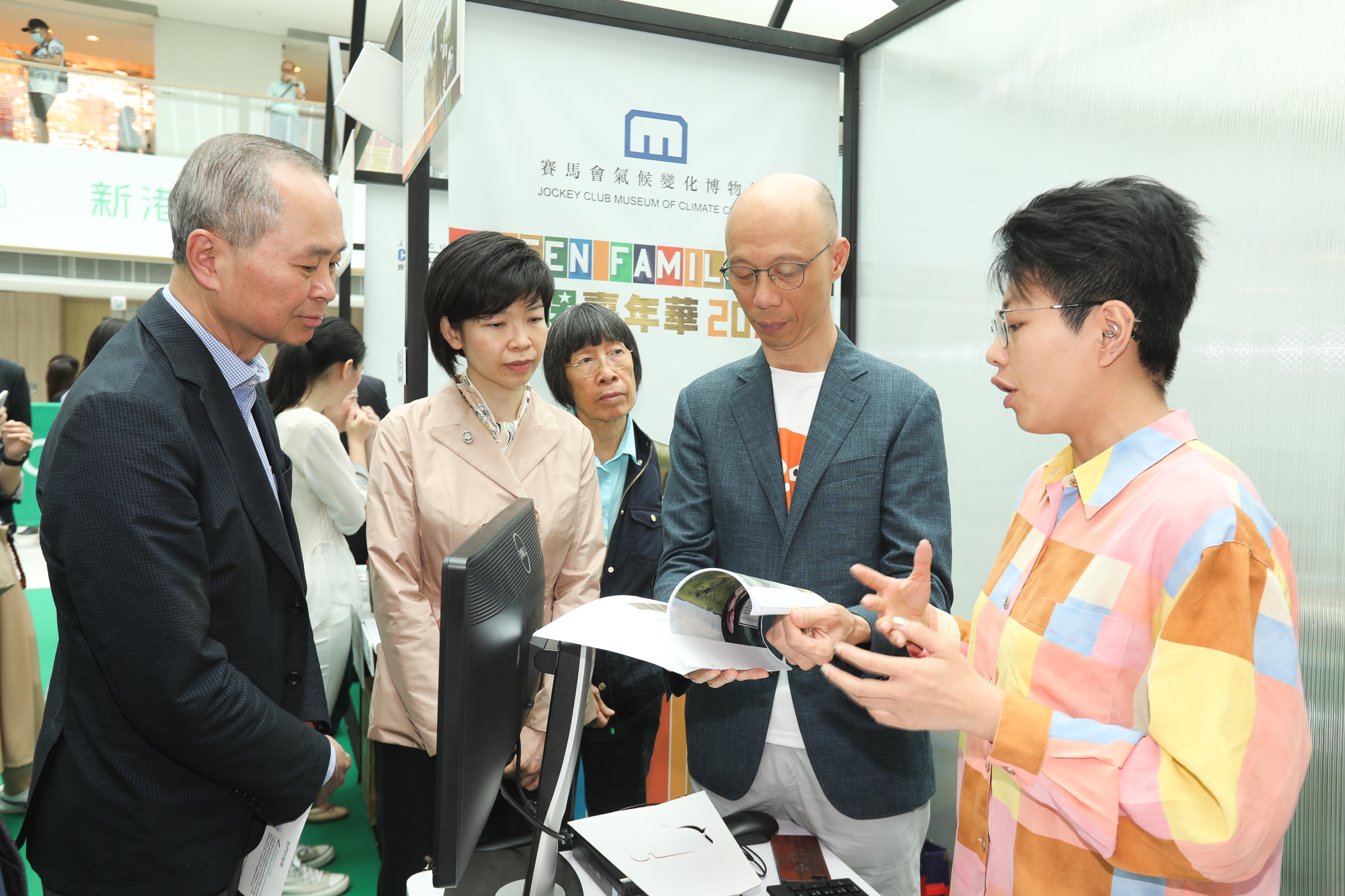 Officiating guests visit sustainable development information and game booths