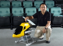 Prof. Liu Yun-hui with the small autonomous helicopter he invented