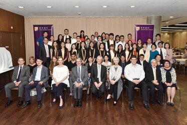 Students and their families pose with Morningside staff and faculty members