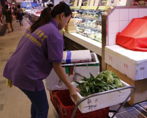 Food for Thought staff collecting food in Tin Shing Shopping Centre.