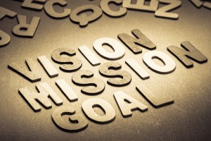 Vision, Mission and Goal words in small wood letters