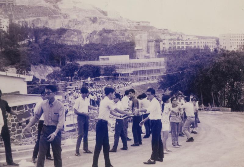 Books being passed from the old library