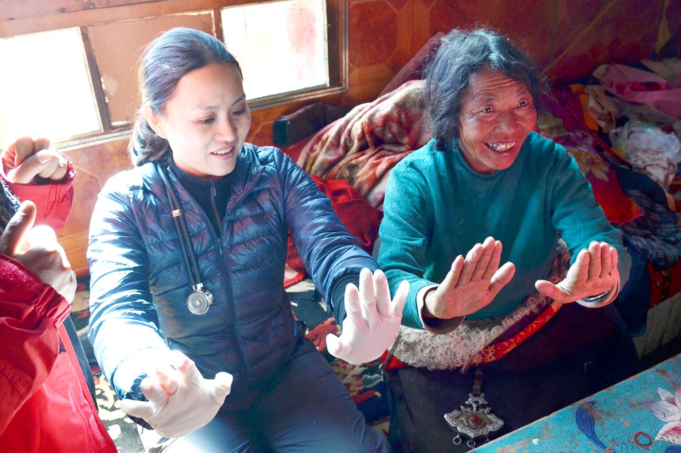 Conducting a basic examination of a Tibetan woman