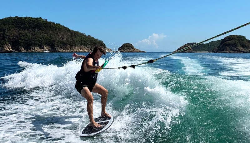 Philip finds wakesurfing a good way to beat the heat.