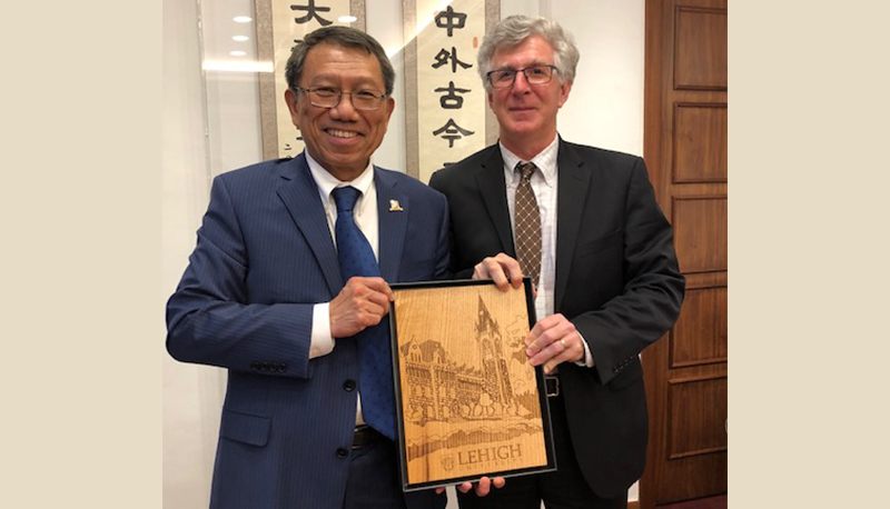 Dr. John Simon (right), President, Lehigh University is warmly welcomed by Prof. Rocky S. Tuan.