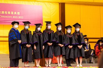 Graduates being blessed and congratulated by Faculty member on stage