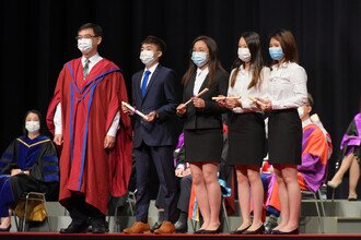 Group photo of student awardees of Schools Session on stage.