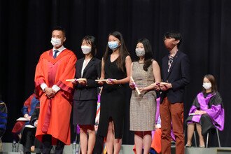 Group photo of student awardees of Schools Session on stage.