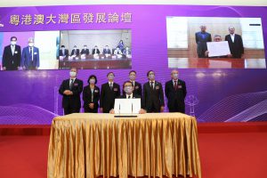 Professor Rocky S. Tuan and Professor Tian Gang (on the screen) sign the MoU regarding the framework agreement on strategic cooperation on Advanced Materials Development and Green Energy Research Institute.