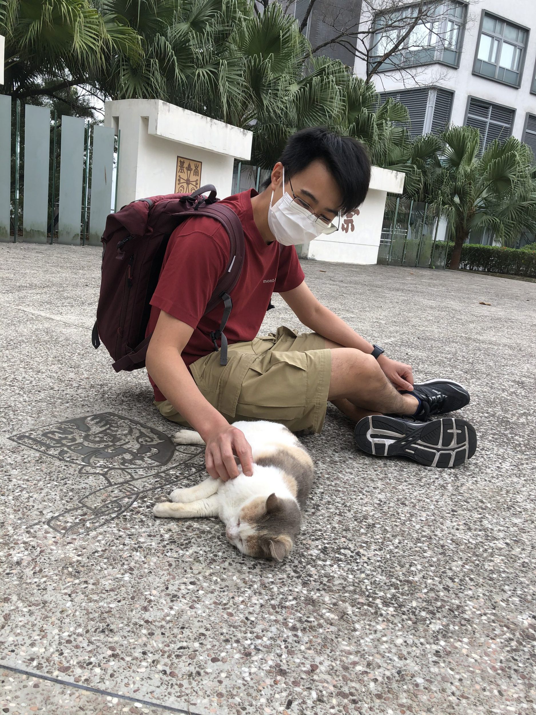 Professor Chan took a picture with Grisha, who is one of the kitties. 