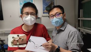 The fingertip-sized soft robot is only of a few centimeters. Professor Li ZHANG (right) and Dr. Yue DONG (left), the first author of the paper.