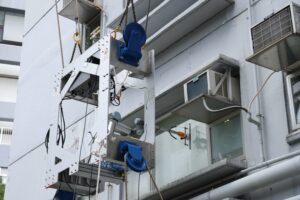 The cable-driven robot can mimic human movement to clean building windows and paint facades. The system is expected to replace human wiper and roller-based window cleaning and facade painting works at high-rise buildings, helping to relieve the industry’s labour shortages. The photo shows the demonstration of window cleaning.