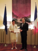 Prof. Ho Pui-yin (left) receives the award from Mr. A. Barthélémy, Consul-General of France in Hong Kong and Macau.