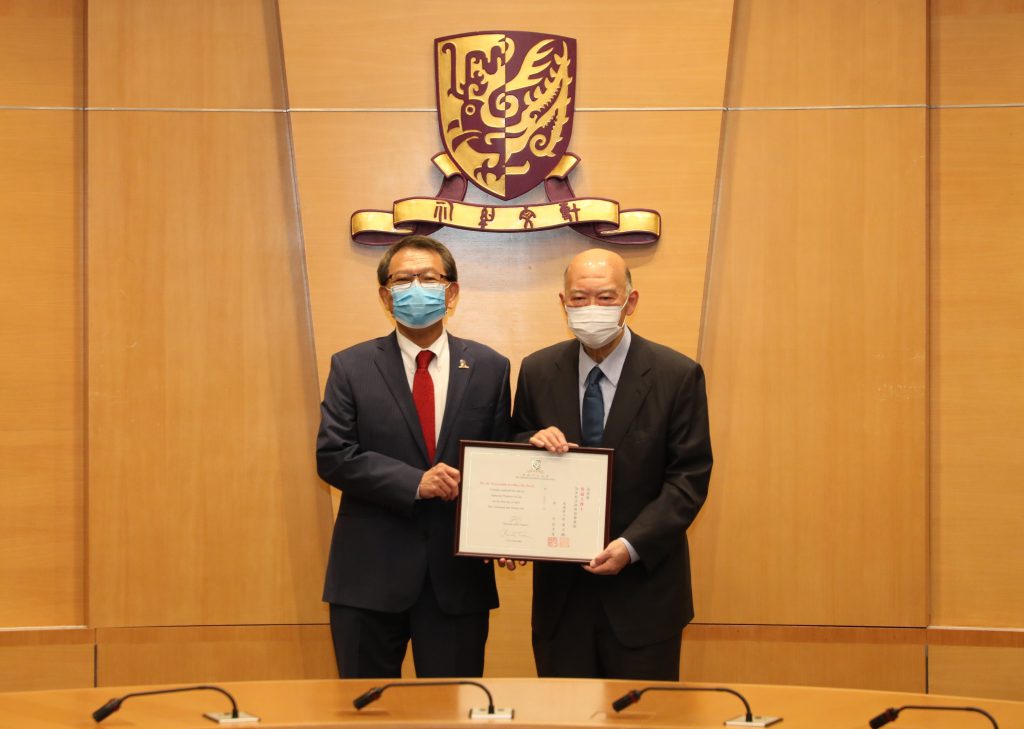 Professor Rocky S. Tuan (left), Vice-Chancellor and President of CUHK presents an appointment certificate of honorary professorship to Dr. the Honourable Geoffrey Ma (right).