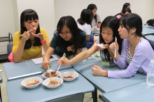 Students taste some of the dishes introduced in ‘A Bite of China’.