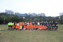 A group photo of the two teams.