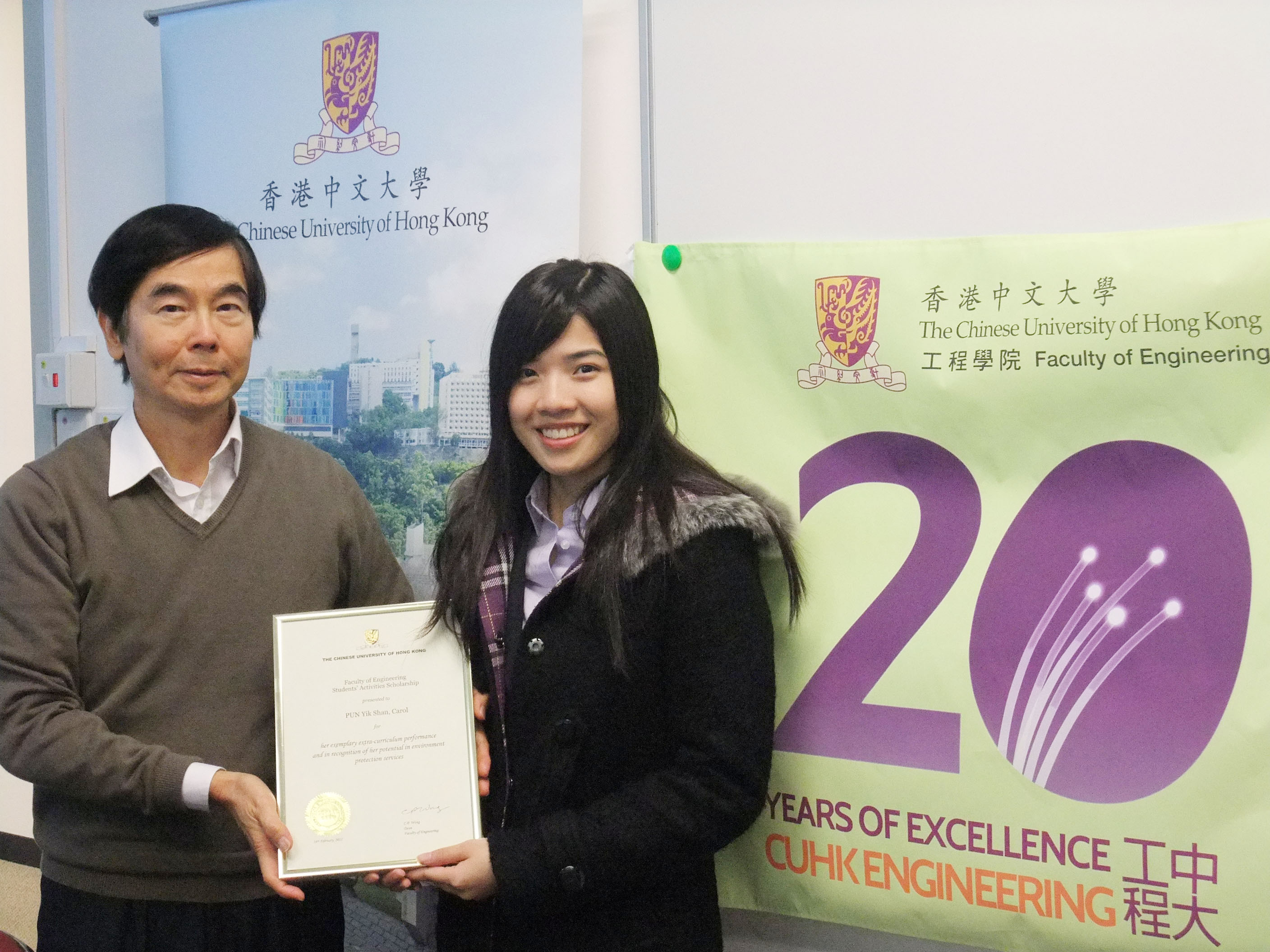 Prof. C.P. WONG, Dean of Engineering, CUHK (left) presents a scholarship to support Carol's South Pole expedition