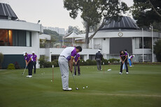 Golfers practising on Putting Green