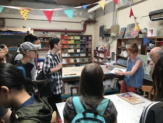 Students are given a tour of the Seagulls Reuse workshop