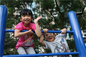 Vanessa Lui Lai-lei’s twins climb on a monkey bar.